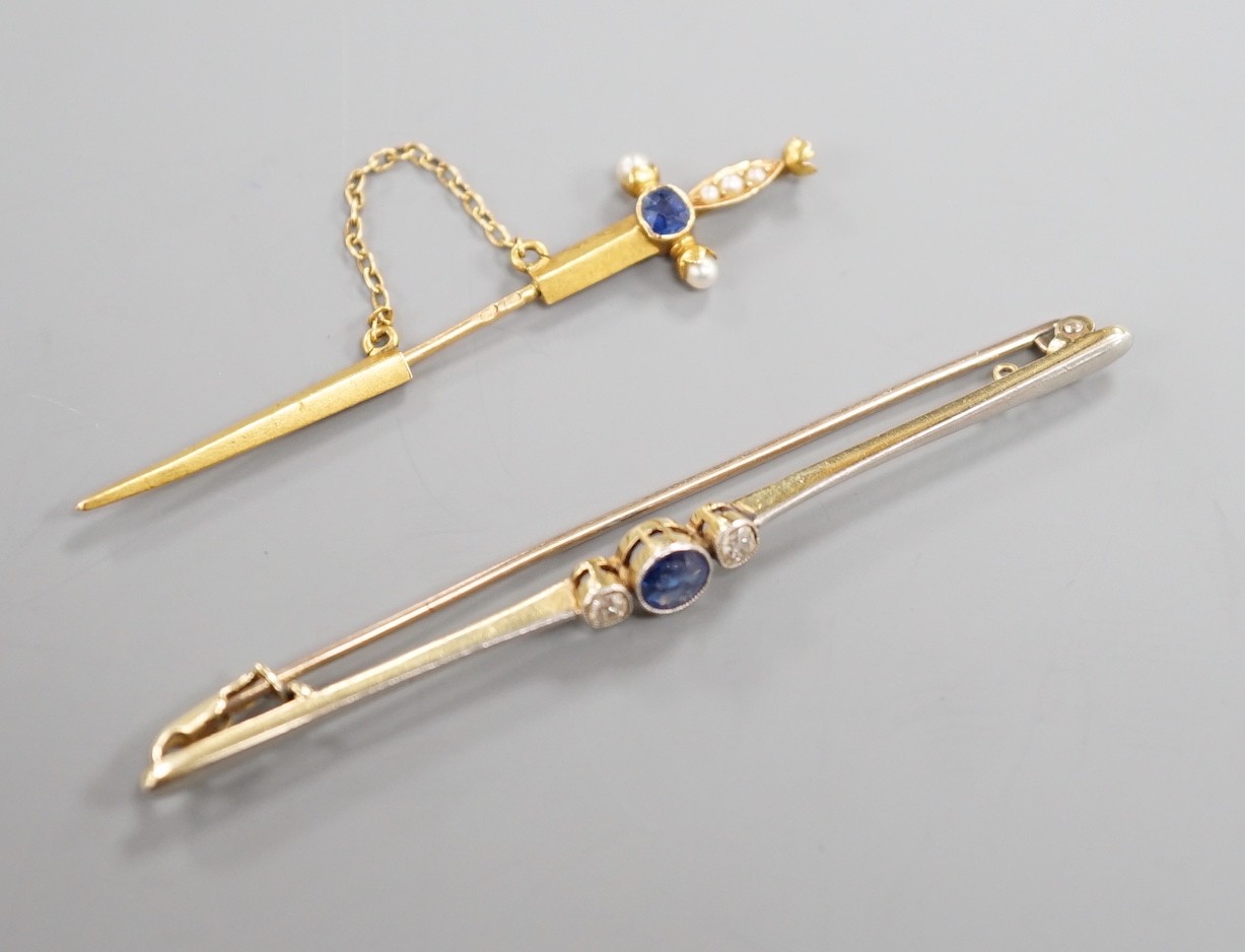 An early 20th French yellow metal (18ct poincon mark), sapphire and seed pearl set jabot pin, modelled a sword, 49mm, gross 1.3 grams and an Edwardian 15ct, sapphire and diamond set bar brooch, gross weight 3.2 grams.